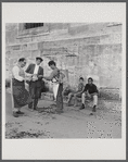 James Baldwin sitting next to boy on Istanbul street