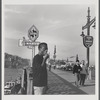 James Baldwin on Istanbul sidewalk, eating