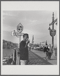 James Baldwin on Istanbul sidewalk, eating