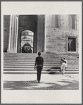 James Baldwin walking toward palace steps