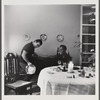 James Baldwin watching Engin Cezzar play tambourine