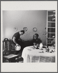 James Baldwin watching Engin Cezzar play tambourine