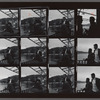 Contact sheet of James Baldwin with lover by the water