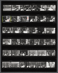 Contact sheet of James Baldwin with others at restaurant