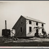 Construction of homes. Libertyville Homesteads, Illinois. Each plot includes a five or six room house and a barn for cow.