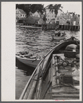 Aboard a trap fishing boat, the end of the trip. About four hours after they have left (in the dark) fishermen return home. By eight o'clock, sometimes nine o'clock, the day's work is finished. Provincetown, Massachusetts.