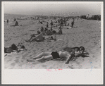 Beach scene at "New Beach," the most popular beach near Provincetown. Regular bus service makes this beach easily available; lack of bath houses causes a great deal of picturesque dressing and undressing in and behind parked cars. Provincetown, Mass.