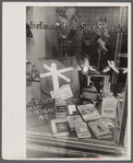 Books on display in show store window, 47th Street, Chicago, Illinois.