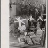 Books on display in show store window, 47th Street, Chicago, Illinois.