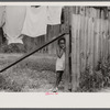Child and laundry in alley dwelling area, Washington, D.C.