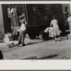 Negroes unloading crates and boxes to be used for firewood, alley dwelling area, Washington, D.C.