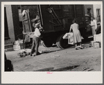 Negroes unloading crates and boxes to be used for firewood, alley dwelling area, Washington, D.C.