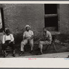 Negroes in front of their homes in the alley dwelling area. Washington, D.C.