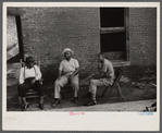 Negroes in front of their homes in the alley dwelling area. Washington, D.C.