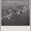 Air view of sugar refinery surrounded by fields. Near Ponce, Puerto Rico.