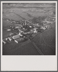 Air view of sugar refinery surrounded by fields. Near Ponce, Puerto Rico.
