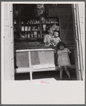 Interior of country store in the hills. Note: everything on the shelves, with the exception of a little coffee and sugar in the glass jars and the bananas hanging from the ceiling, is imported. Puerto Rico.