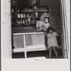 Interior of country store in the hills. Note: everything on the shelves, with the exception of a little coffee and sugar in the glass jars and the bananas hanging from the ceiling, is imported. Puerto Rico.