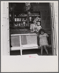Interior of country store in the hills. Note: everything on the shelves, with the exception of a little coffee and sugar in the glass jars and the bananas hanging from the ceiling, is imported. Puerto Rico.