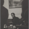 James Baldwin seated and in discussion