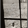 James Baldwin in abandoned lot amid rubble