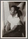 James Baldwin sitting in profile