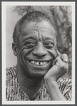 James Baldwin smiling in headshot