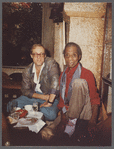 James Baldwin seated with Jacques Gomot