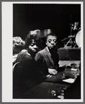 James Baldwin with woman at jazz club