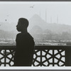 James Baldwin in profile with minarets