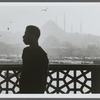 James Baldwin in profile with minarets