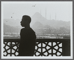 James Baldwin in profile with minarets