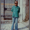 James Baldwin in flared blue jeans