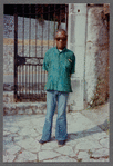 James Baldwin in flared blue jeans