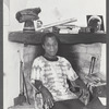 James Baldwin leaning back with cigarette