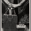 James Baldwin at podium with two microphones