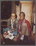 James Baldwin seated with Jacques Gomot