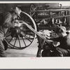 Rehabilitation client looking over farm implements, Jackson, Ohio