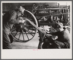 Rehabilitation client looking over farm implements, Jackson, Ohio