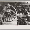 Rehabilitation client looking over farm implements, Jackson, Ohio