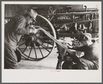 Rehabilitation client looking over farm implements, Jackson, Ohio