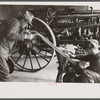 Rehabilitation client looking over farm implements, Jackson, Ohio