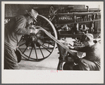 Rehabilitation client looking over farm implements, Jackson, Ohio