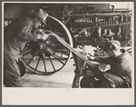 Rehabilitation client looking over farm implements, Jackson, Ohio