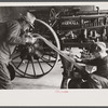 Rehabilitation client looking over farm implements, Jackson, Ohio