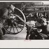 Rehabilitation client looking over farm implements, Jackson, Ohio