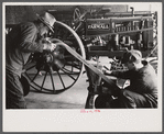 Rehabilitation client looking over farm implements, Jackson, Ohio
