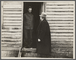 Resettlement Administration representative at door of rehabilitation client's house, Jackson County, Ohio.