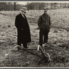 Resettlement Administration representative and rehabilitation client looking over farm machinery. Jackson County, Ohio.