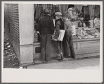 Newsboys admiring sporting goods, Jackson, Ohio.